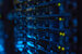 Futuristic background image of rack server with blinking lights in supercomputer