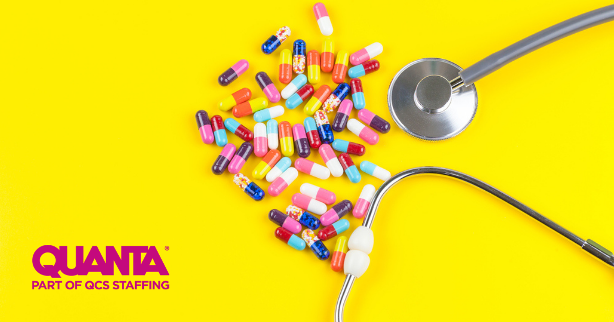 stethoscope and colourful pills on a yellow background