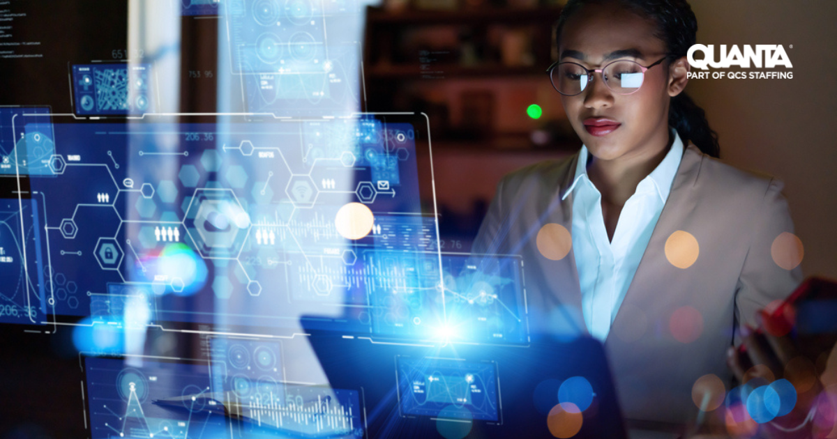 woman wearing shirt and blazer looking at laptop