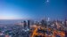 Aerial panoramic view of tallest towers in Dubai Downtown skyline night to day transition before sunrise. 