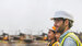 male and two females wearing hard hats and high visibility and smiling