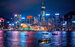 Hong Kong skyline night view with boats in the water