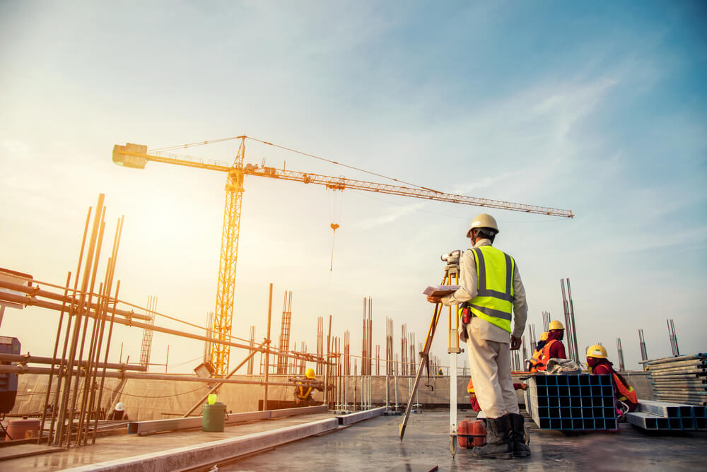 image of a building site with a crane in the background