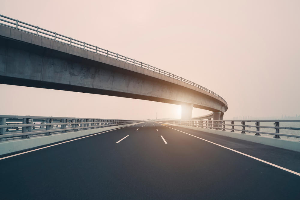 highway set against a pink sky