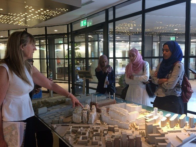 image of the team looking on the study tour looking at designs