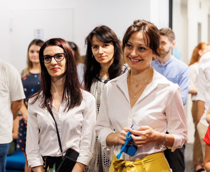 People in the Romania office smiling