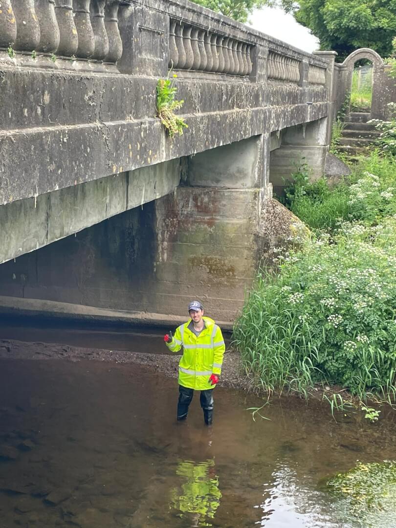 image of an engineer under a bridge