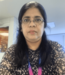 Image of Sangeeta in office wearing ID