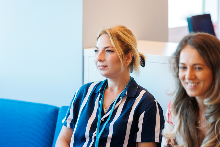 Picture of two women sitting in the office