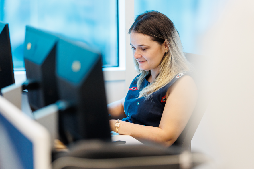 Photo of a woman sitting on a chair and working