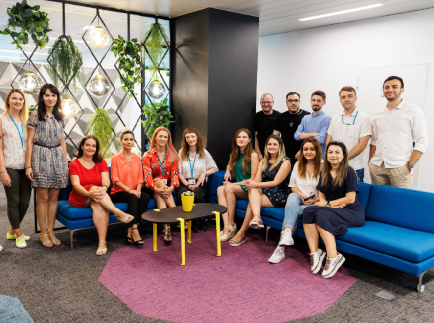 Bucharest team posing for a picture in the Romania office