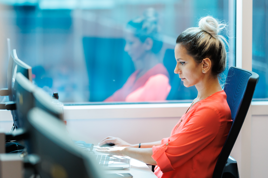 Photo of a woman sitting on a chair and working