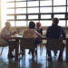 Employees sitting in a meeting.