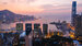 Aerial scenery panoramic view of Hong Kong Evening with metropolitan bay Victoria Harbor at sunset.