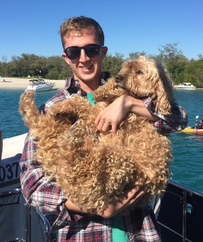 Man holding a dog