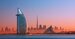 Dubai - city center skyline and famous Jumeirah beach at sunset, United Arab Emirates