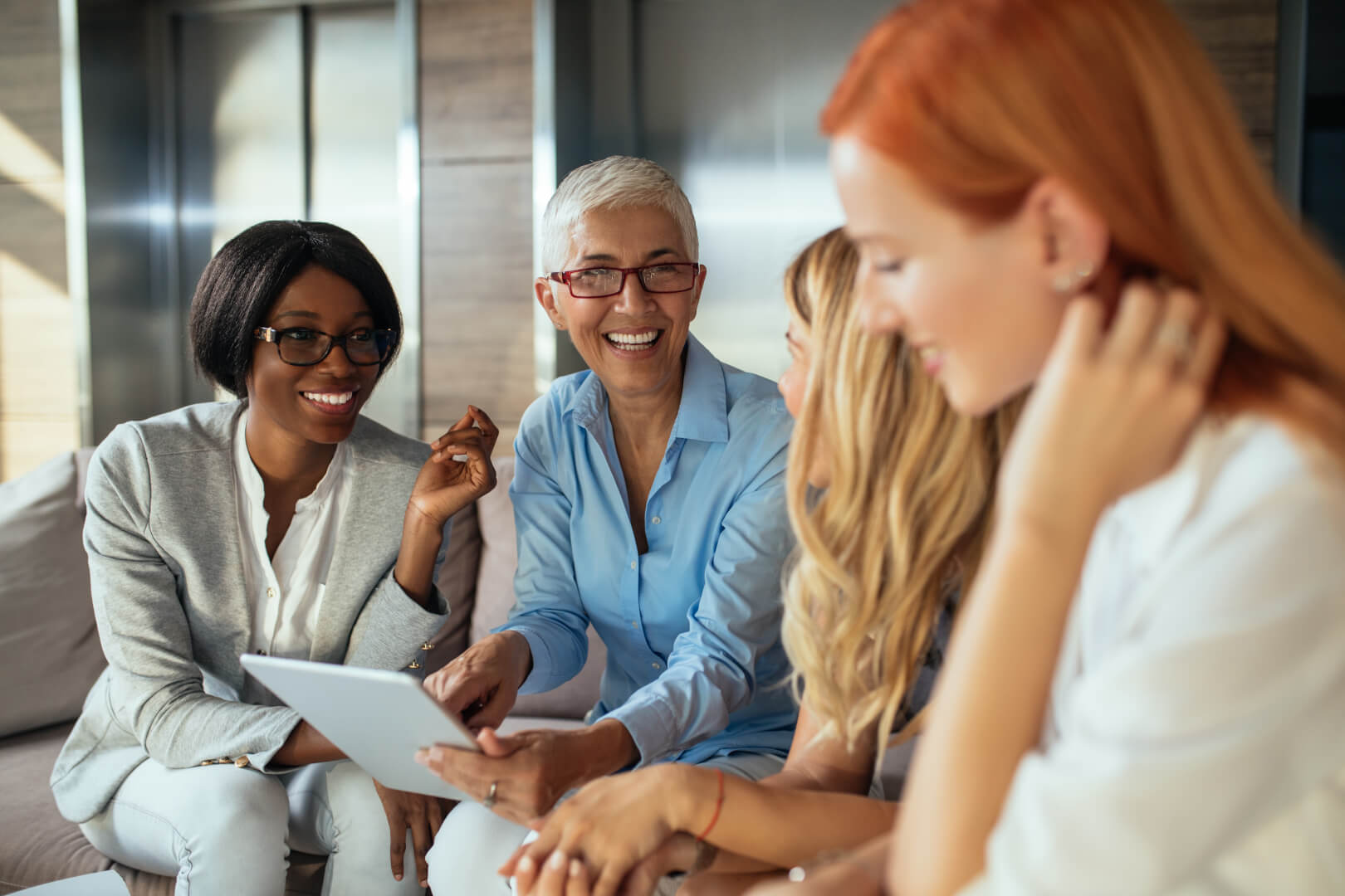 group of women working and laughing together