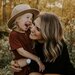 woman hugging a girl and smiling