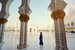 Woman standing in the Sheikh Zayed Grand Mosque, famous Abu Dhabi sightseeing.