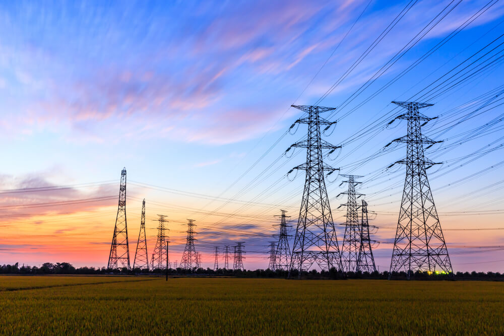 this is an image of power lines at sunset