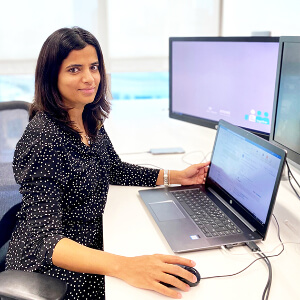 image of Purva at her desk