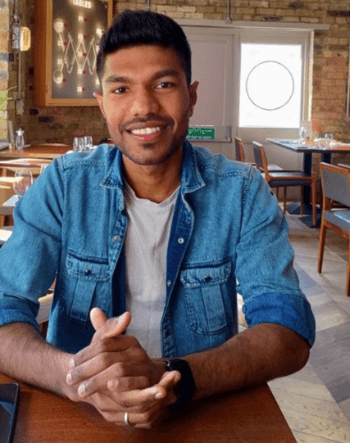 Photo of Naresh sitting in a cafe