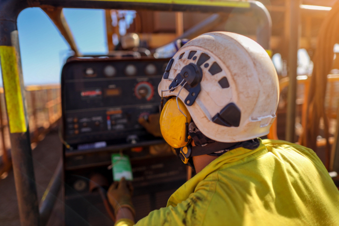 Engineer wearing protective equipment while inspecting work