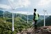 Young maintenance engineer man working in wind turbine on the mountain,Power generation Saving and using renewable energy concept.