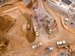 Overhead shot of vehicles at work on a mining project