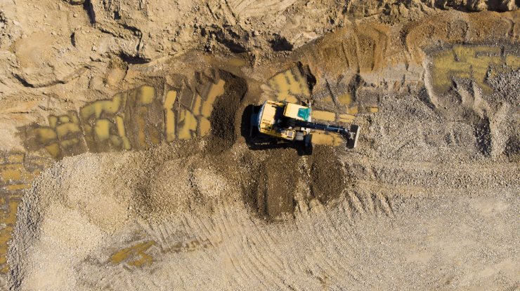 image of a crane moving stones