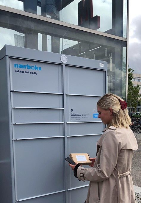 image of a person using an automated package Locker