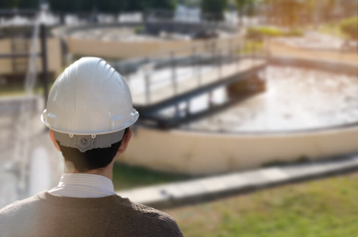 image of a man looking at a water facility