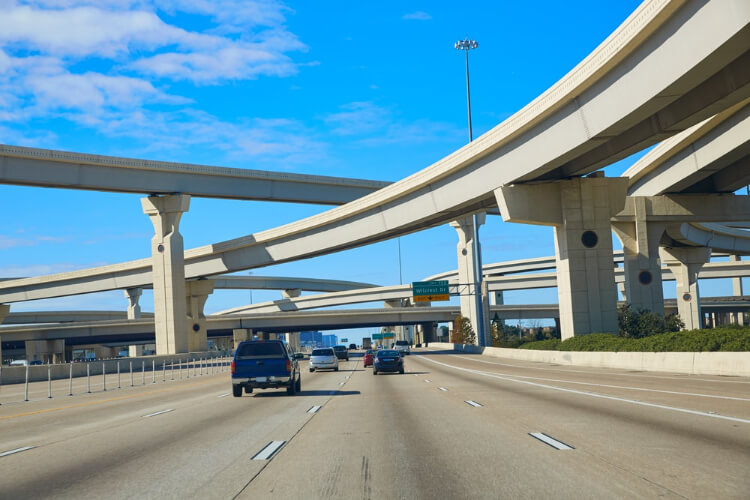 image of cars driving along a bridge