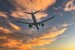 image of plane flying in cloudy sky