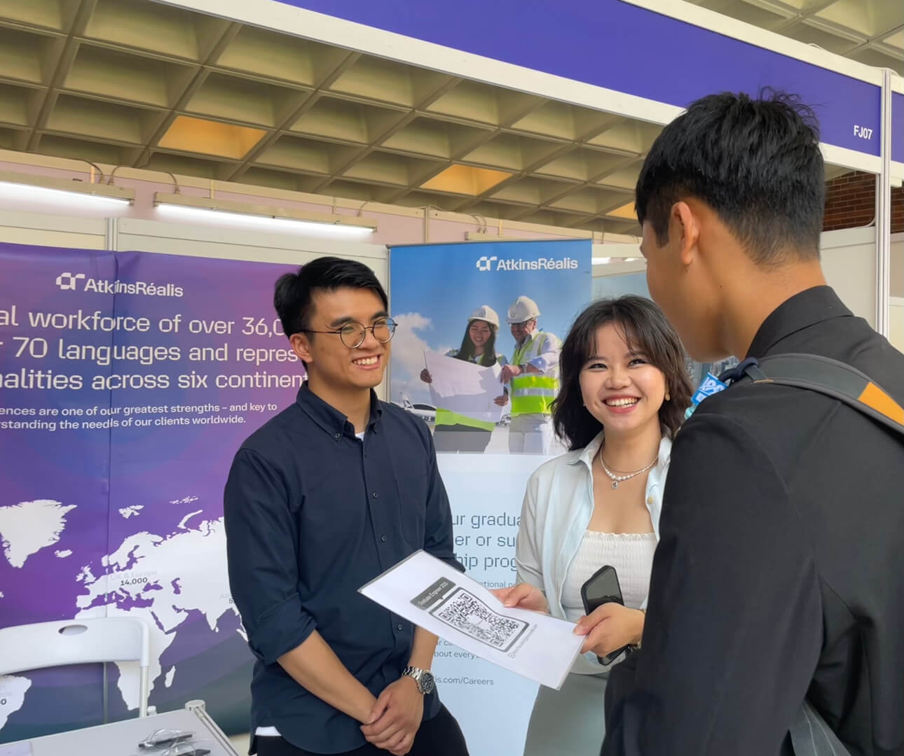 Image of 2 ladies standing at a students career fair