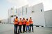 Project managers standing outside a building