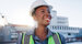Happy, black woman project engineer with vision in city for construction, industrial development or architecture.