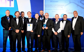 A group picture of John & his colleagues after winning an award.