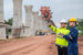 An Asian male engineer works at a motorway bridge construction site,Civil worker inspecting work on crossing construction,Supervisor working at high-speed railway construction site