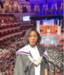 Makaita in her graduation gown posing for the camera.