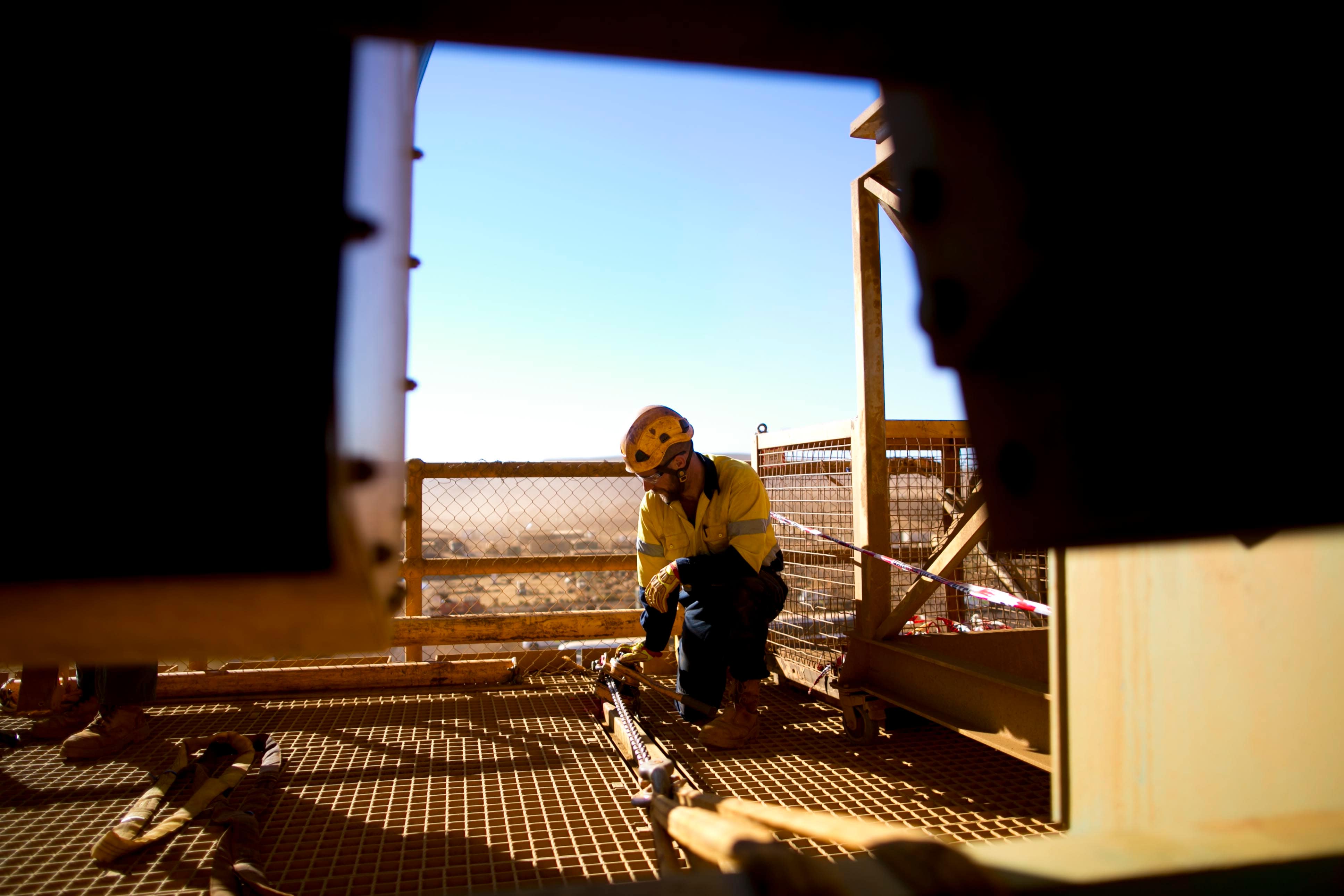 worker measuring on construction site