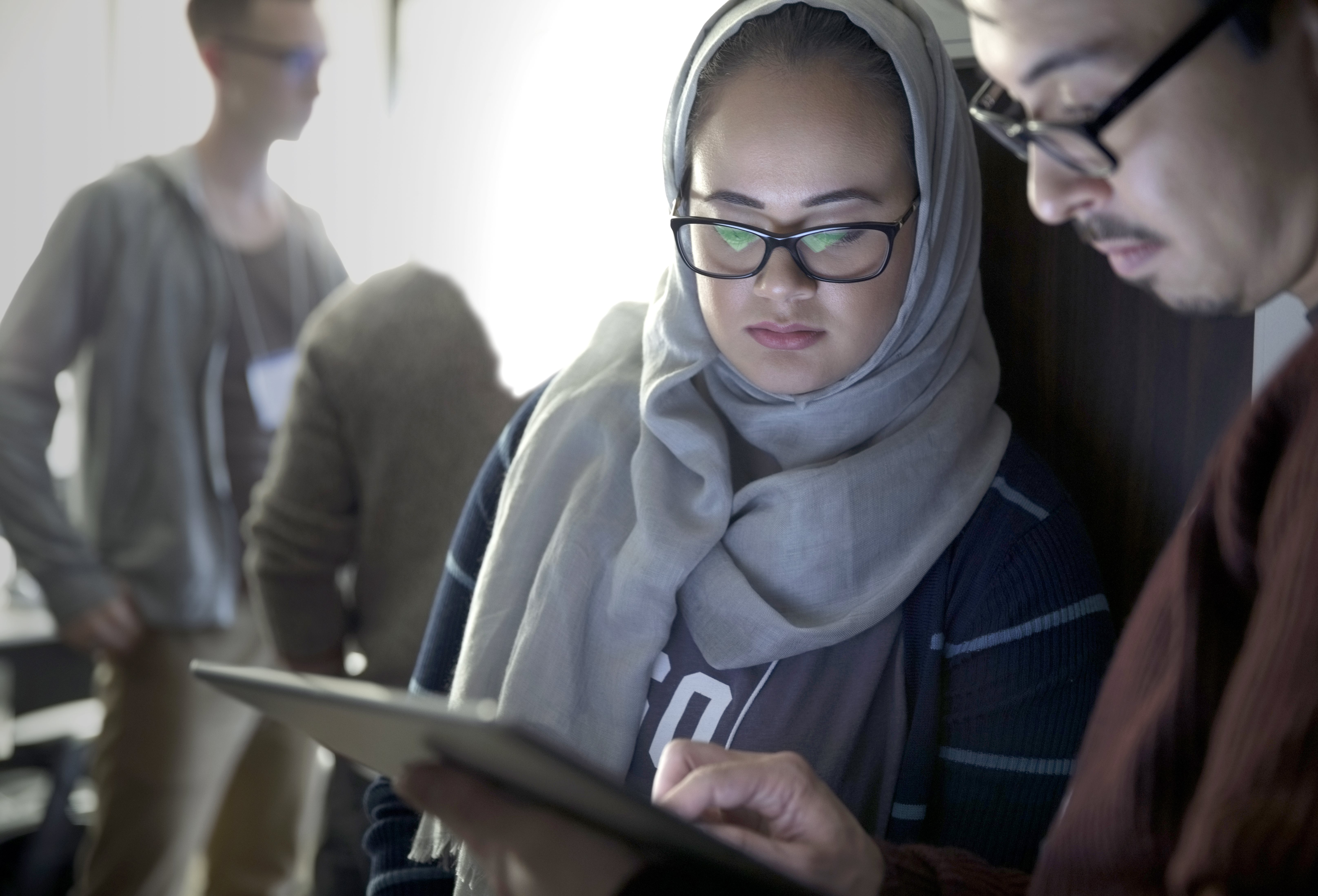 Two person with a tablet