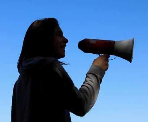 woman with a speaker