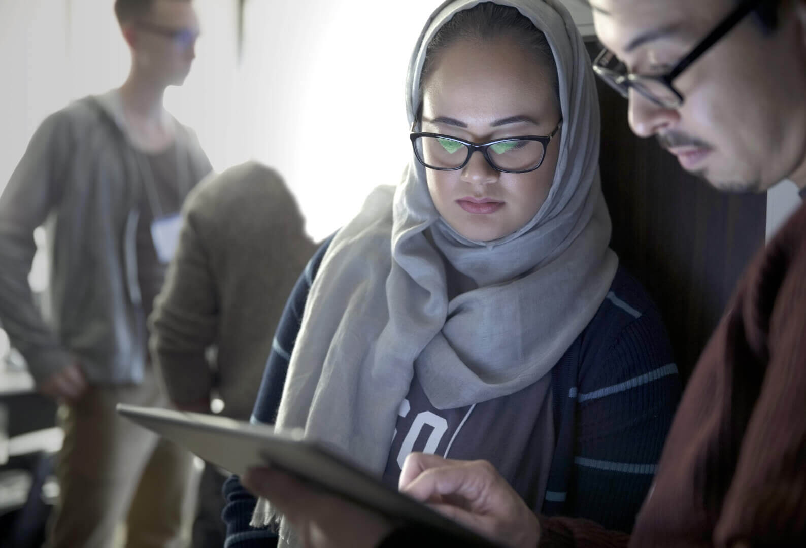 two person with a tablet