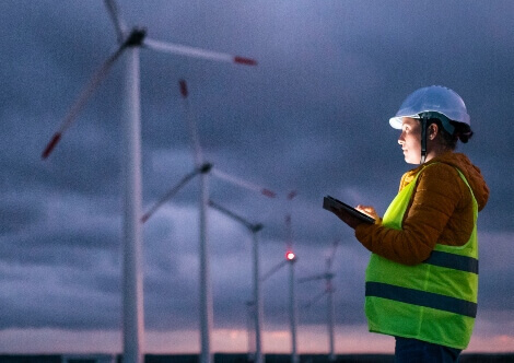 Engineer next to the wind turbines