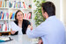 Interview with smiling lady shaking a man's hand
