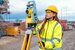 Surveyor wearing protective gear on a building site