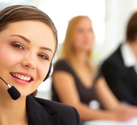 woman facing the camera with a headset and mic.