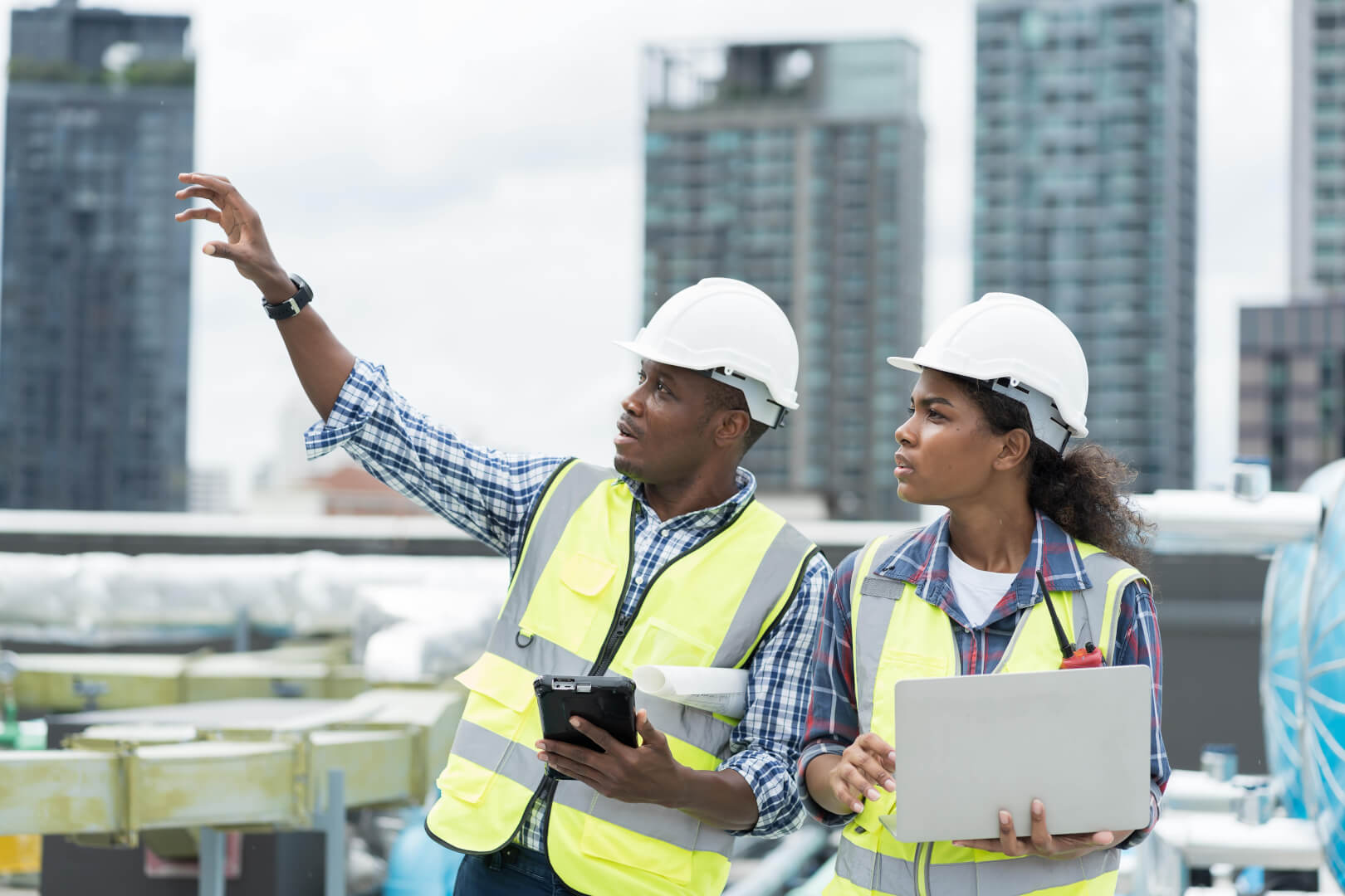 two engineers with clipboards