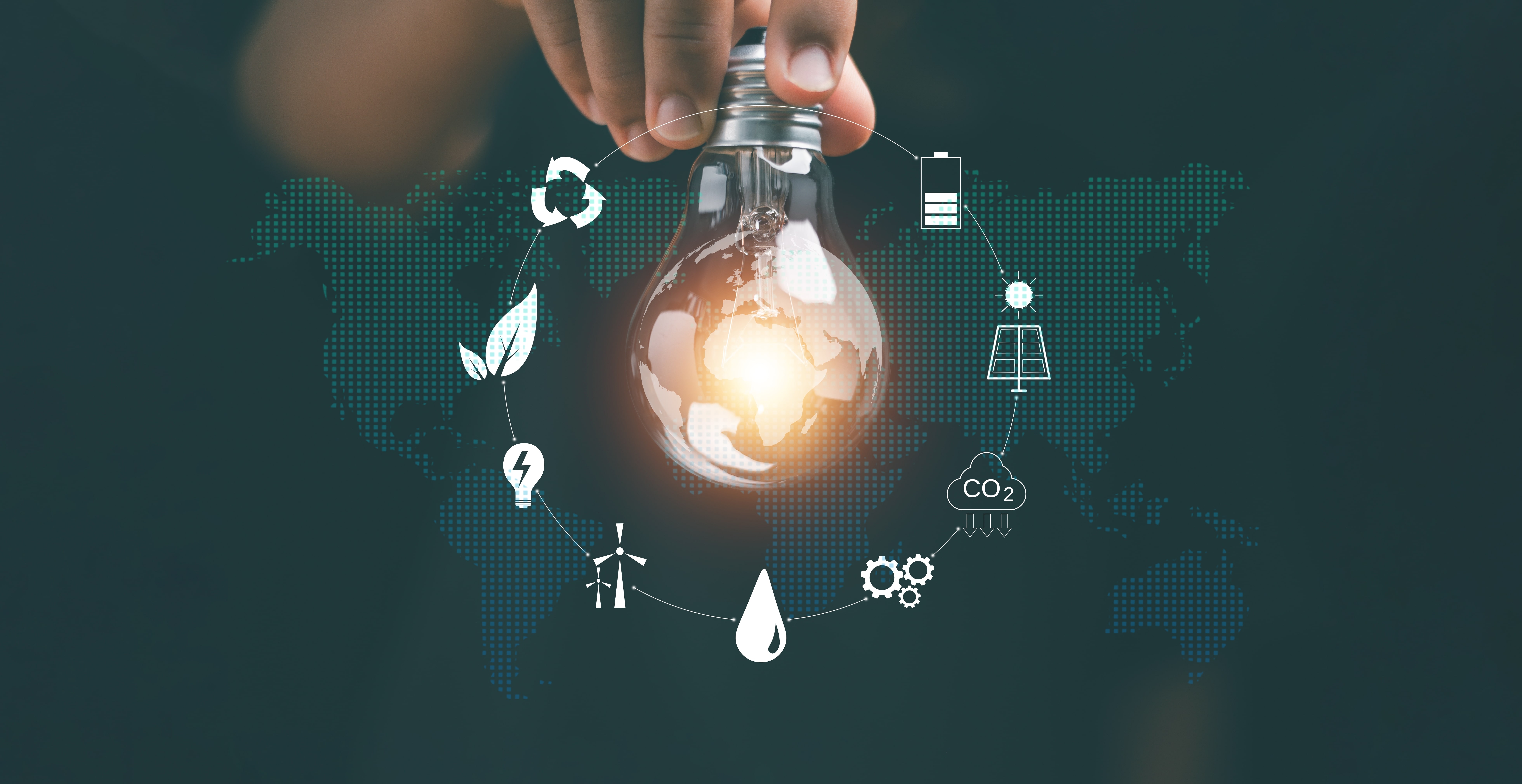 Hand holding light bulb with icons energy sources for renewables